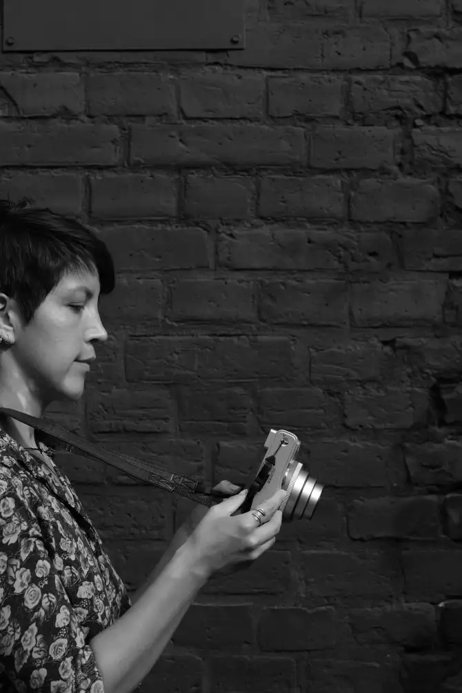 Photos of Ursula going on a walk, holding a instant camera, and exploring the city.